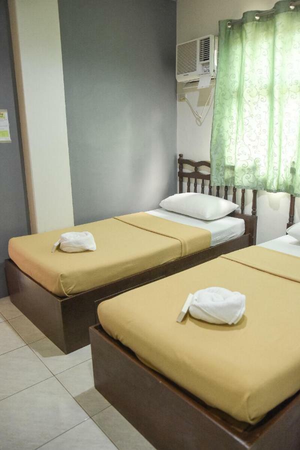 Tiptop Tower Suite Inn Dumaguete City Kamer foto